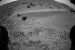 Mars Curiosity rover grabs a bit of soil