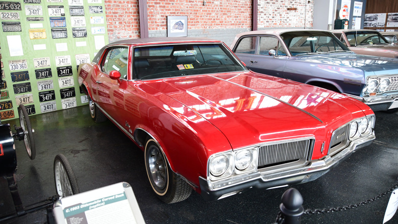 Red 1970 Oldsmobile Cutlass Supreme SX seen from right front on display in Virginia Museum of Transportation