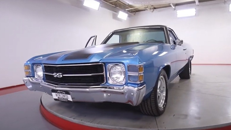 Blue 1971 GMC Sprint SS similar to SP seen from front left on display on a rotating pedestal
