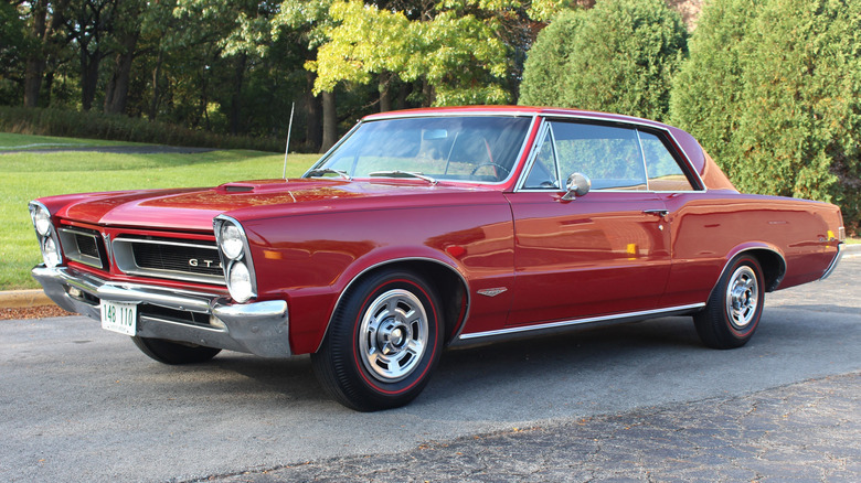 Red 1965 Pontiac GTO seen from left front