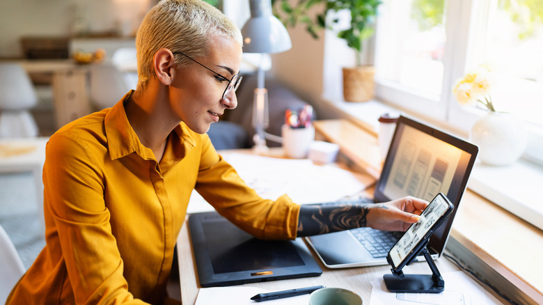 Woman with phone stand