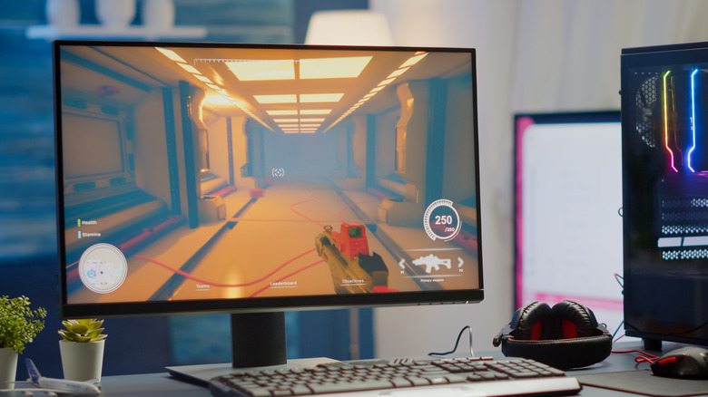 A desktop PC setup with a first-person game running on it.