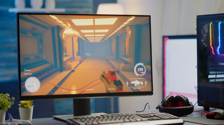 A desktop PC setup with a first-person game running on it.