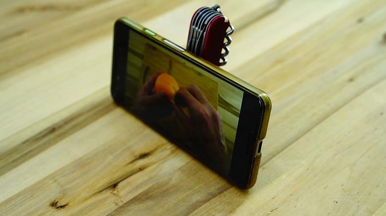 swiss army knife cell phone stand parcel hook