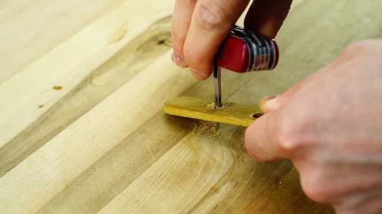 swiss army knife awl wood hole drill