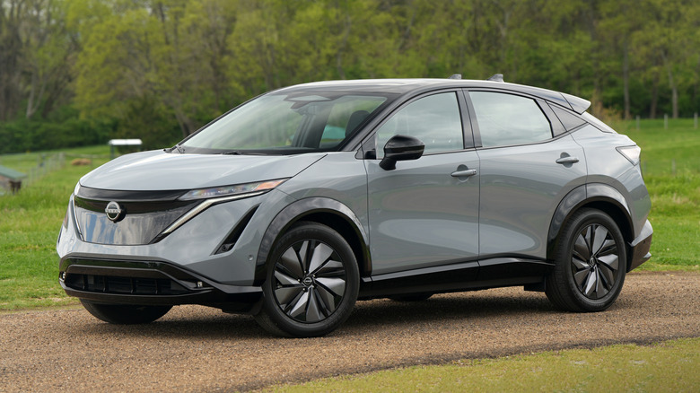 Nissan Ariya on gravel driveway.