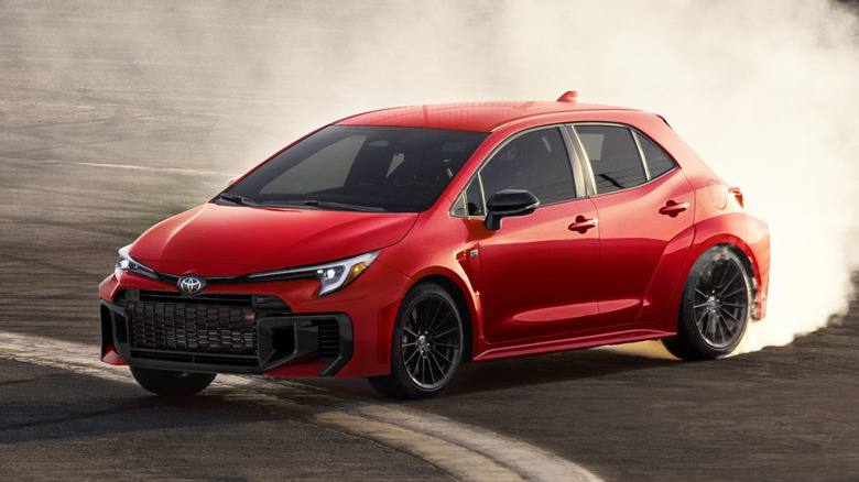Red Toyota GR Corolla smoking tires