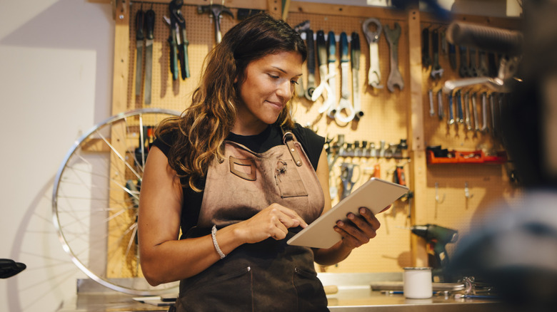 Woman buying tools on Amazon with a tablet