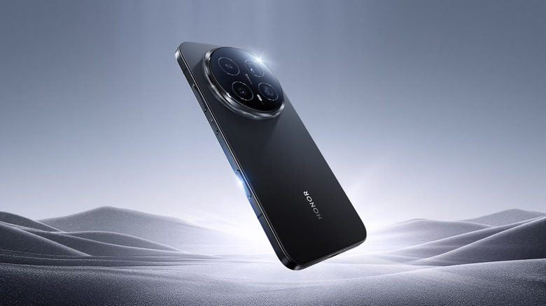 The Honor Magic8 Pro on a black and white sandy background