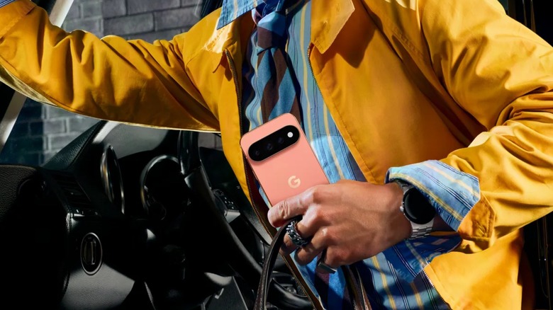 Person in brightly colored clothes holding a pink Google Pixel 11 Pro