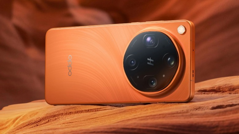 Orange Oppo Find X9 Ultra on a rock