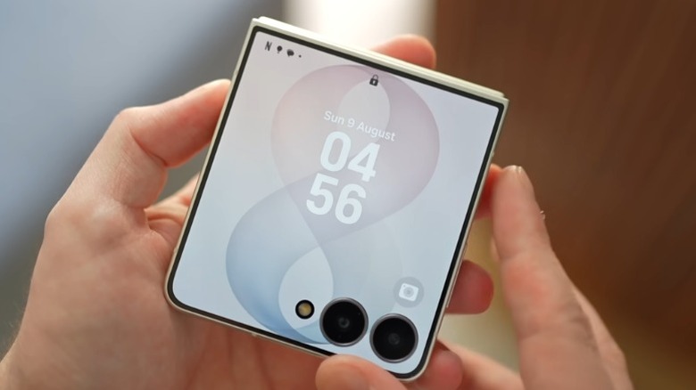 Hands holding a folded Samsung Galaxy Z Flip 8
