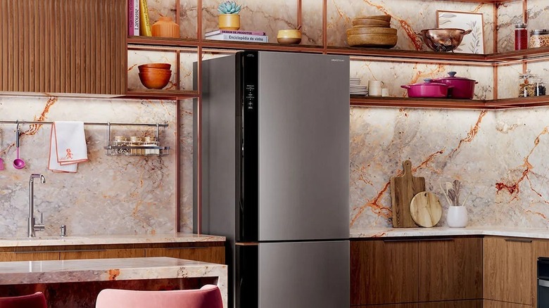 Smart Brastemp frost free inverse stainless steel refrigerator installed in a modern kitchen