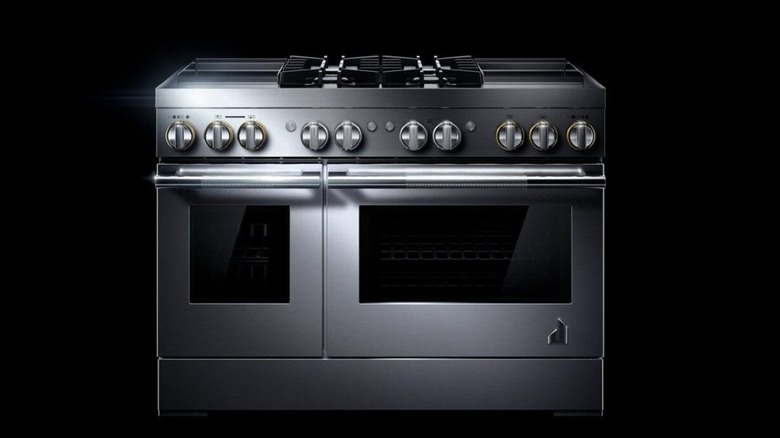 A combination JennAir appliance oven and range top against a black background