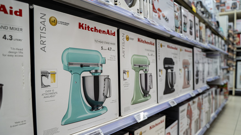 Row of KitchenAid stand mixers in a store