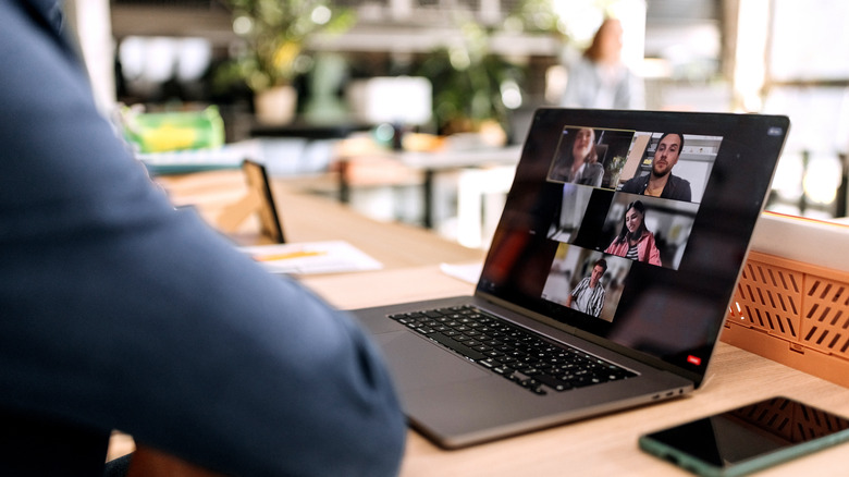 a laptop with a Zoom meeting