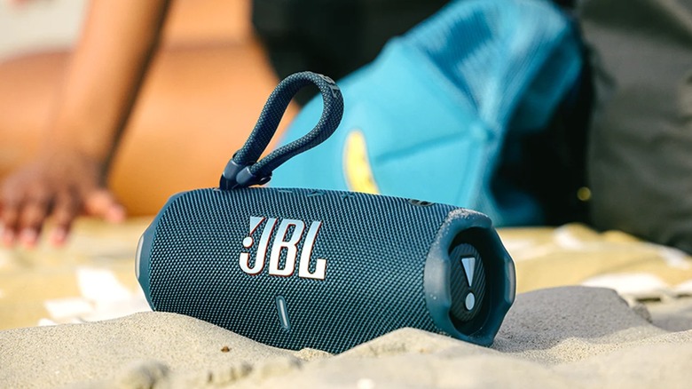 JBL Charge 6 on a sandy beach.
