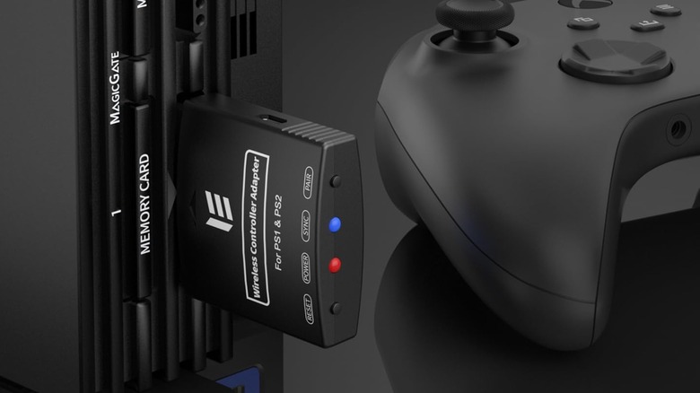An RGEEK controller adapter plugged into a PlayStation 2 next to an Xbox controller