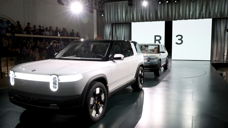 The Rivian R2 and R3 on a show floor
