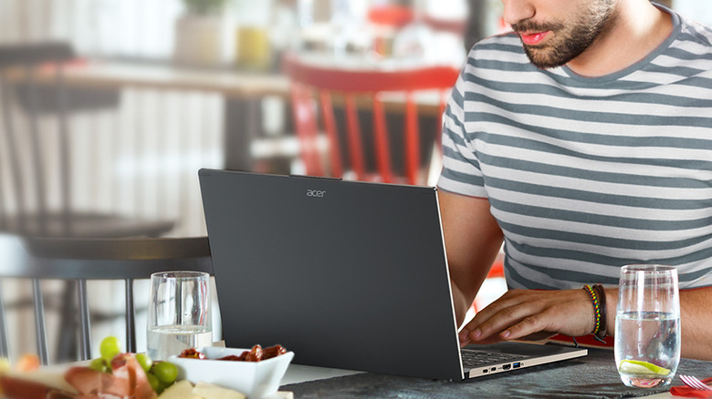 A person working on the Acer Aspire 16