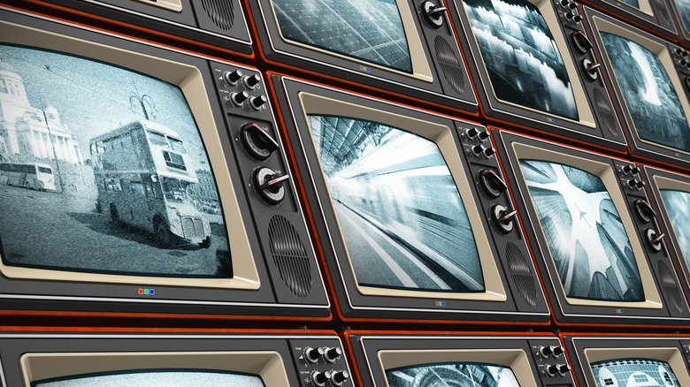 Several old tv boxsets showing black and white  footage