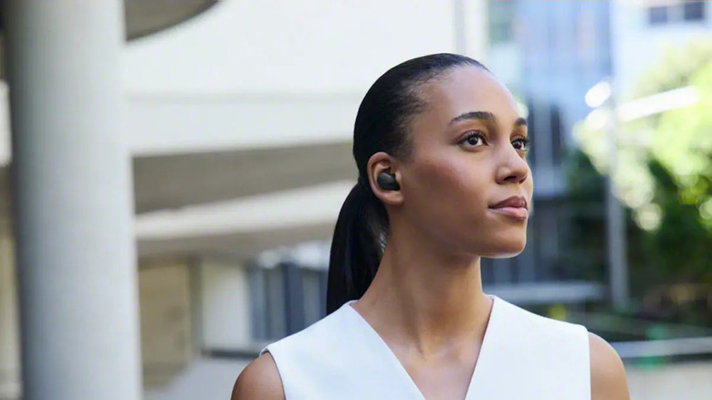 A person wearing the Sony WF-1000XM6 wireless earbuds