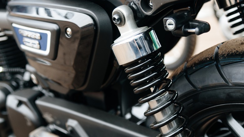 a rear shock absorber installed on a motorcycle