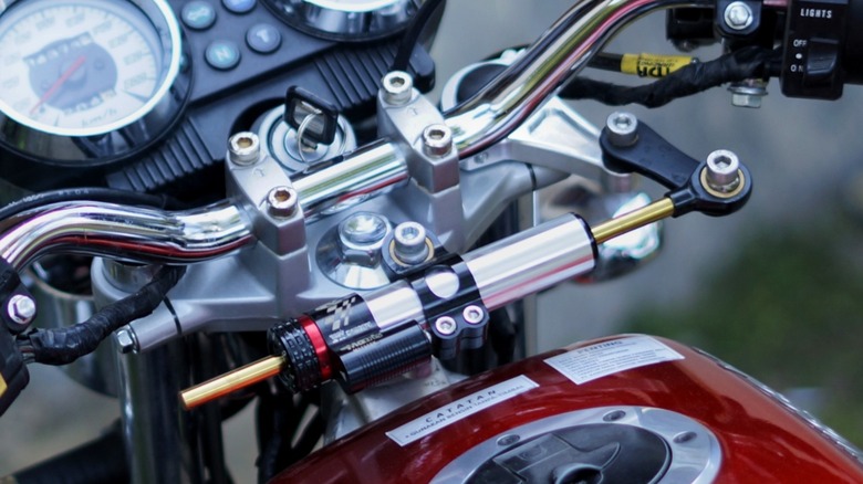 a steering damper installed on a motorcycle