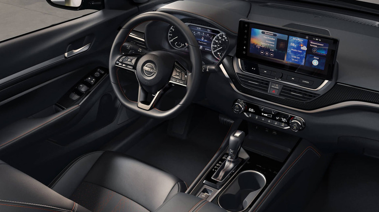 The interior and steering wheel of a Nissan Altima