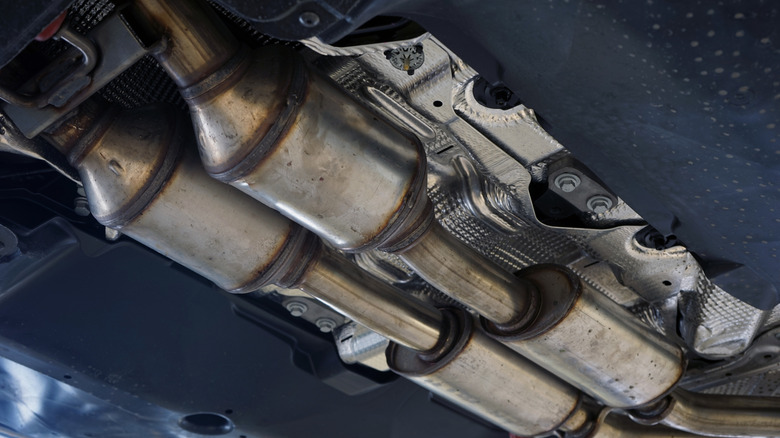 View of catalytic converters attached under a car