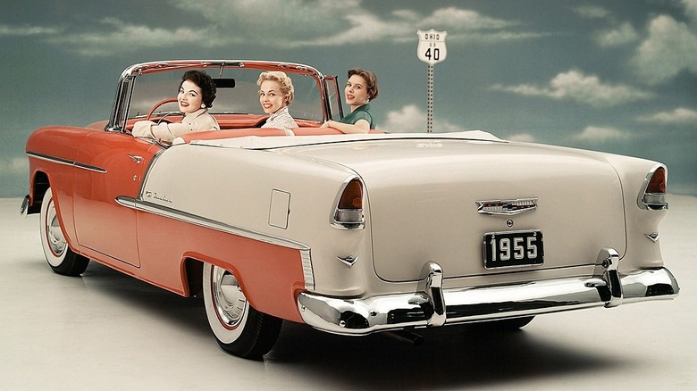 Three people in a Chevy Bell Air convertible
