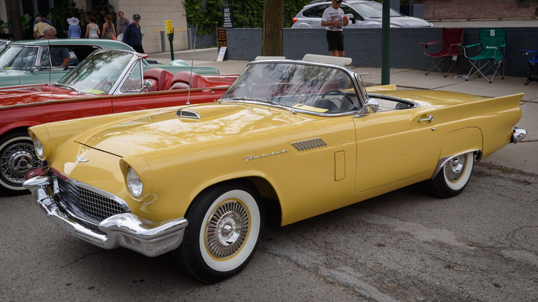 Yellow 1957 Ford Thunderbird parked on street