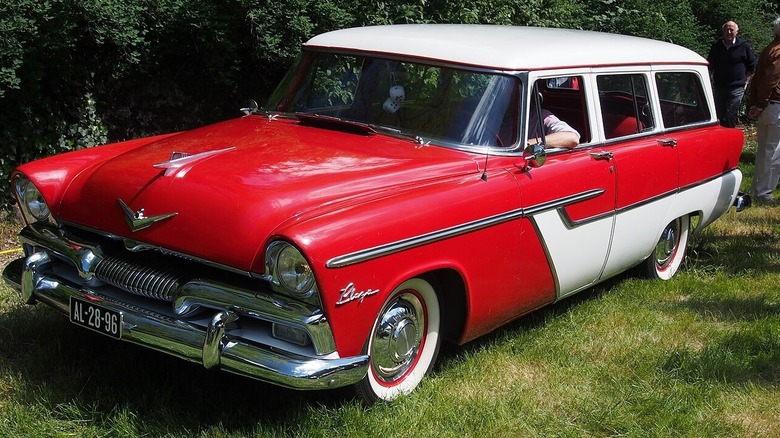 Red and white Plymouth Belvedere on grass