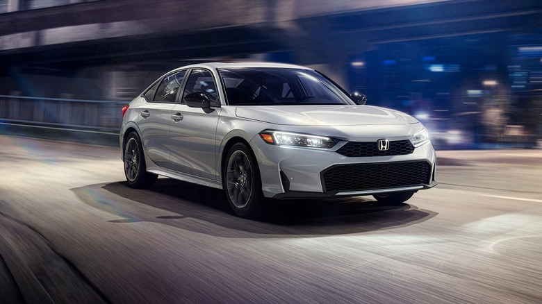 A front end shot of a 2026 Honda Civic driving