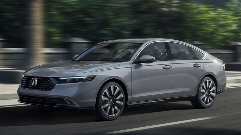 Gray Honda Accord driving in an urban environment