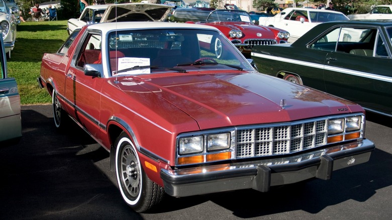 Red Ford Fairmont Futura parked at a car show