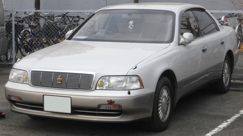 White Toyota Crown Majesta parked in parking lot