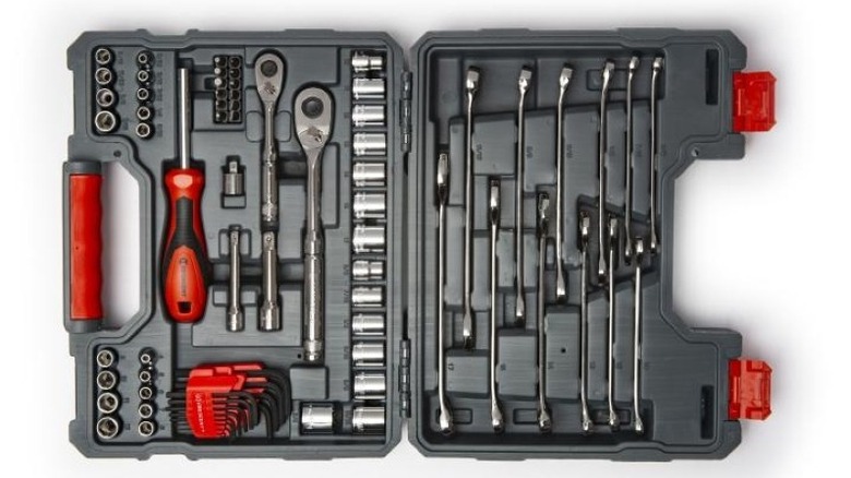 open tool case with wrenches, sockets, and other tools