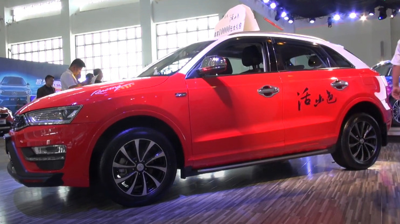 A Red Zotye S21/ SR7 on display at its launch event indoors