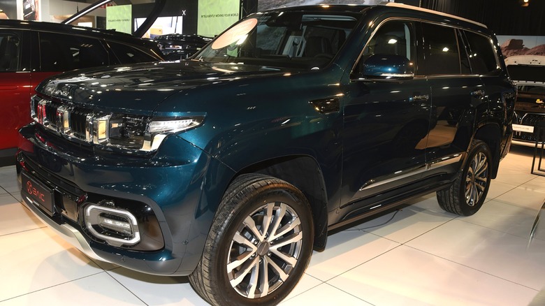 A green BAIC BJ60 at the 101st Brussels Motor show, on display indoors