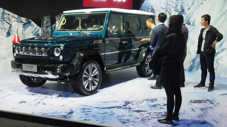 A Green BAIC BJ80 at a launch event in 2019 surrounded by people