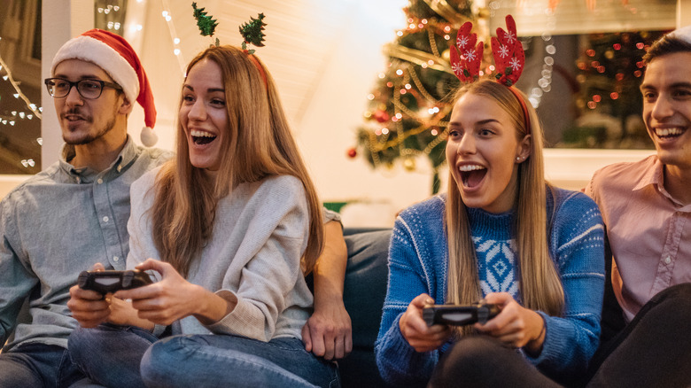 Family playing games at Christmas