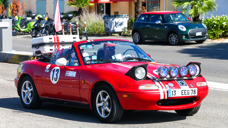 Red Mazda Miata with pop-up headlight