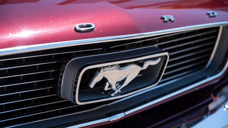 Red Ford mustang grille logo