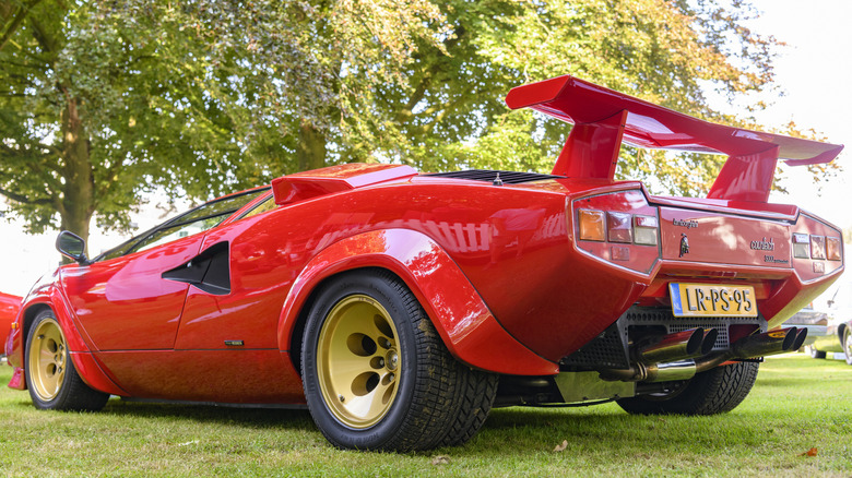 A red Lamborghini Countach on display on a lawn at the 2019 Concours D'Elegance