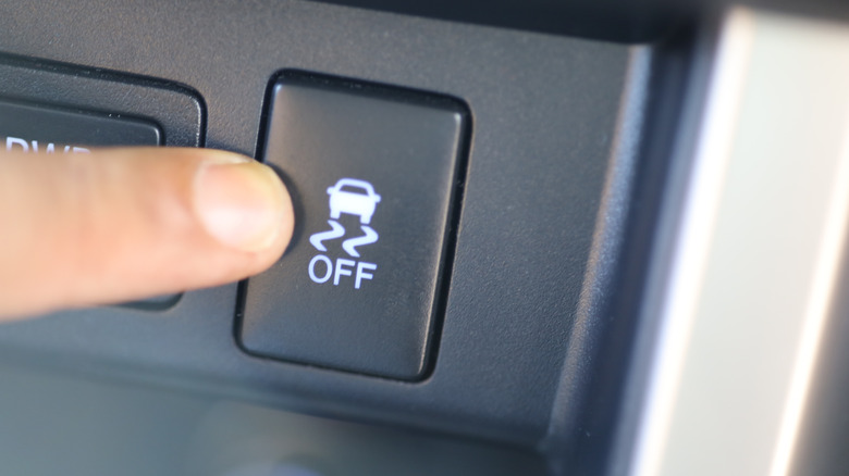 Driver pressing traction control button