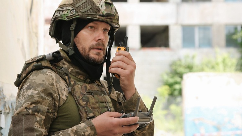 a soldier using a radio