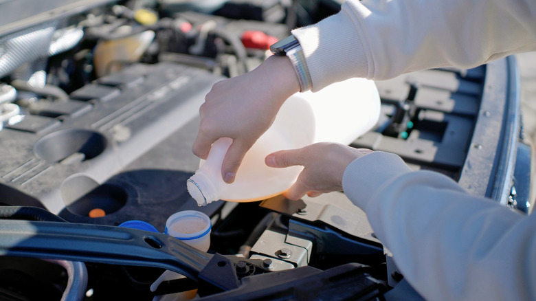 Adding coolant to reservoir