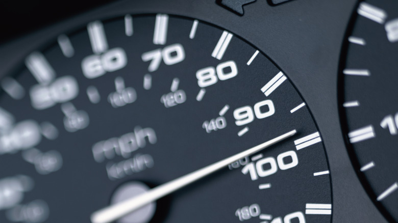 closeup of car speedometer at 99 mph