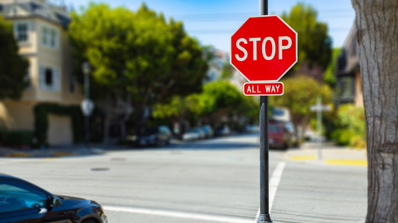 a car at a four-way stop sign